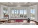 Living room featuring hardwood floors, sliding glass doors leading to a covered deck, and tasteful coastal decor at 3128 Palmetto Blvd, Edisto Island, SC 29438