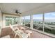 Covered outdoor porch featuring a view of the beach and Intracoastal waterway at 3128 Palmetto Blvd, Edisto Island, SC 29438