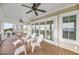 Outdoor porch featuring adirondack chairs, ceiling fans, and views of the gulf at 3128 Palmetto Blvd, Edisto Island, SC 29438