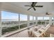 Spacious outdoor porch featuring water views and comfortable seating near the beach at 3128 Palmetto Blvd, Edisto Island, SC 29438