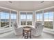 Cozy sitting area with panoramic ocean views, providing an inviting spot to relax and enjoy the coastal scenery at 3128 Palmetto Blvd, Edisto Island, SC 29438