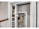 Accessible attic storage with shelving and carpet; perfect for organized storage at 3128 Palmetto Blvd, Edisto Island, SC 29438
