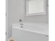 Modern bathtub with chrome fixtures under a window with blinds at 321 Abercom Place Dr, Moncks Corner, SC 29461