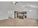 Open-concept kitchen featuring wooden cabinets, stainless appliances, granite countertops and wood floors at 321 Abercom Place Dr, Moncks Corner, SC 29461