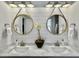 Modern bathroom with dual sinks, marble countertops, and shiplap accent wall at 3381 Stockdale St, Mount Pleasant, SC 29466