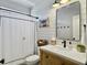 Stylish bathroom with shiplap walls, a modern vanity, and a shower with a black-trimmed curtain at 3381 Stockdale St, Mount Pleasant, SC 29466