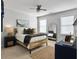 Comfortable bedroom with a woven bed frame, a ceiling fan, and a full-length mirror at 3381 Stockdale St, Mount Pleasant, SC 29466