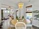 Bright dining room features a round table with decorative chandelier and light wood flooring at 3381 Stockdale St, Mount Pleasant, SC 29466