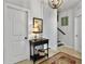 Hallway featuring stylish table, artwork, and view of staircase at 3381 Stockdale St, Mount Pleasant, SC 29466