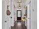 Inviting hallway with hardwood floors, stylish lighting, and neutral paint, providing a welcoming entrance at 3381 Stockdale St, Mount Pleasant, SC 29466