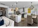 Modern kitchen with white cabinets, stainless steel appliances, and an island with seating at 3381 Stockdale St, Mount Pleasant, SC 29466