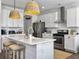 Bright kitchen with white cabinets, subway tile backsplash, stainless steel appliances, and a marble island at 3381 Stockdale St, Mount Pleasant, SC 29466