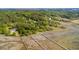 Expansive aerial view of marsh front homes with beautiful piers surrounded by lush green foliage and serene waters at 3399 Freeman Hill Rd, Johns Island, SC 29455