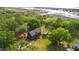 Aerial view of the home surrounded by marshland, nestled among lush green trees and foliage at 3399 Freeman Hill Rd, Johns Island, SC 29455