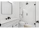 Modern bathroom featuring a glass-enclosed shower with a rainfall showerhead and sleek, black fixtures at 3399 Freeman Hill Rd, Johns Island, SC 29455