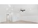 Spacious bedroom with white walls, modern ceiling fan, and light wood-look floors, offering a serene ambiance at 3399 Freeman Hill Rd, Johns Island, SC 29455