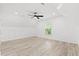 Bright and airy bedroom featuring a modern ceiling fan, ample lighting, and a large window at 3399 Freeman Hill Rd, Johns Island, SC 29455