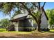 Single-Gathering home featuring a charming porch, blending comfort and style in a serene landscape at 3399 Freeman Hill Rd, Johns Island, SC 29455