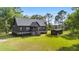 A picturesque single-Gathering home with a large yard, shed, and inviting entrance at 3399 Freeman Hill Rd, Johns Island, SC 29455