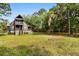 Charming two-story home with a well-maintained lawn and lush trees, creating a peaceful and inviting atmosphere at 3399 Freeman Hill Rd, Johns Island, SC 29455