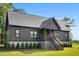 Delightful single-Gathering home featuring a welcoming porch and nicely trimmed greenery at 3399 Freeman Hill Rd, Johns Island, SC 29455