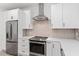 Modern kitchen showcases stainless steel appliances, white cabinets, drawers, and stylish hardware at 3399 Freeman Hill Rd, Johns Island, SC 29455