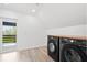 Bright laundry room featuring modern appliances, wood countertops, and an exterior door to a balcony at 3399 Freeman Hill Rd, Johns Island, SC 29455