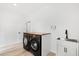 Well-lit laundry room featuring modern appliances, countertop space, and a utility sink at 3399 Freeman Hill Rd, Johns Island, SC 29455
