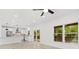 Bright open concept living area flowing into a modern kitchen with stainless steel appliances and island at 3399 Freeman Hill Rd, Johns Island, SC 29455