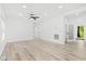 Spacious living area with light wood floors, neutral walls, recessed lighting, and multiple entryways at 3399 Freeman Hill Rd, Johns Island, SC 29455