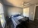 Cozy bedroom featuring neutral paint, plank floors, a ceiling fan and a closet at 3801 Battleview Ct, North Charleston, SC 29420