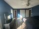 Inviting bedroom with dark wood floors and an en-suite bathroom at 3801 Battleview Ct, North Charleston, SC 29420