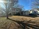 Charming two-story home with an attached two car garage, and mature landscaping under a sunny sky at 3801 Battleview Ct, North Charleston, SC 29420