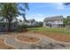 Landscaped backyard featuring a stone path, storage shed, and mature trees at 4019 Cascades Thrust, Summerville, SC 29483