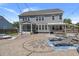 Stunning backyard with a spacious patio, outdoor seating, and string lights creating an inviting ambiance at 4019 Cascades Thrust, Summerville, SC 29483