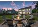 Spacious backyard featuring a cozy fire pit and ample seating for entertaining at 4019 Cascades Thrust, Summerville, SC 29483