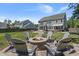 Beautiful backyard with a stone fire pit and seating area perfect for entertaining at 4019 Cascades Thrust, Summerville, SC 29483