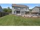 Expansive backyard featuring a patio, outdoor seating, and well-maintained lawn at 4019 Cascades Thrust, Summerville, SC 29483