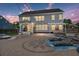 Stunning backyard with a spacious patio, outdoor seating, and string lights creating an inviting ambiance at 4019 Cascades Thrust, Summerville, SC 29483