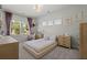 Charming bedroom with a daybed, ample natural light, and whimsical decor creating a playful atmosphere at 4019 Cascades Thrust, Summerville, SC 29483
