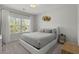 Cozy bedroom with neutral tones, plush bedding, and abundant natural light filtering through the window at 4019 Cascades Thrust, Summerville, SC 29483