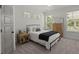 Cozy bedroom with carpet, windows with white blinds, a queen bed, and warm lighting at 4019 Cascades Thrust, Summerville, SC 29483