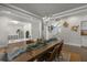 Spacious dining room with elegant lighting, adjacent to a versatile playroom at 4019 Cascades Thrust, Summerville, SC 29483