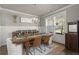 Elegant dining room with modern chandelier and large window view at 4019 Cascades Thrust, Summerville, SC 29483