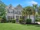 Charming two-story gray home with landscaped yard and beautiful palm trees at 4019 Cascades Thrust, Summerville, SC 29483