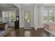 Bright foyer with hardwood floors and natural light streaming through the front door at 4019 Cascades Thrust, Summerville, SC 29483