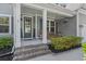 Welcoming front porch with hanging flower baskets, perfect for relaxing outdoors at 4019 Cascades Thrust, Summerville, SC 29483