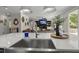 Bright, open kitchen with a large island sink, hardwood floors, and a view to the living room at 4019 Cascades Thrust, Summerville, SC 29483
