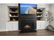Cozy living room with modern fireplace, built-in shelves, and a mounted TV for relaxation at 4019 Cascades Thrust, Summerville, SC 29483