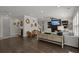 Spacious living area with modern decor, fireplace, staircase, and stylish hardwood floors at 4019 Cascades Thrust, Summerville, SC 29483